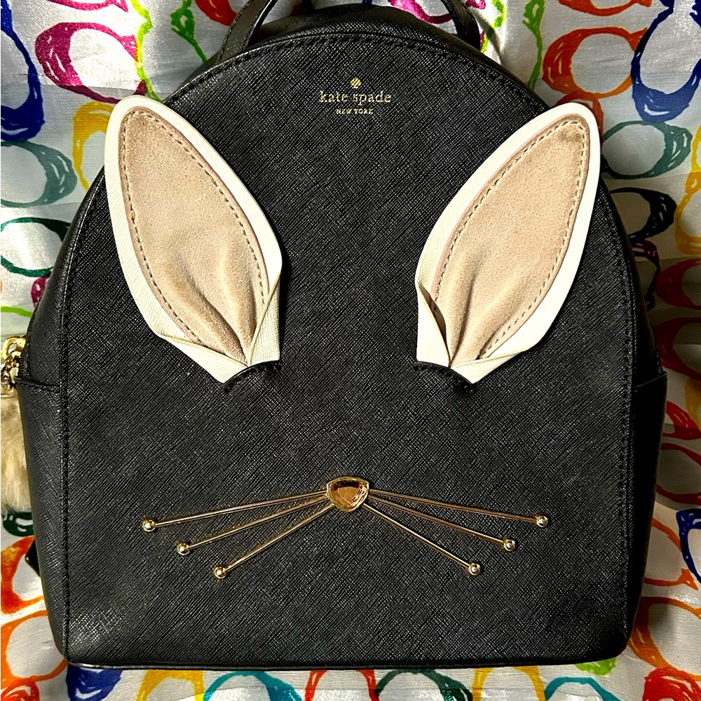 Bag is in good condition. Clean interior! Measures approximately 10” by 10”.
